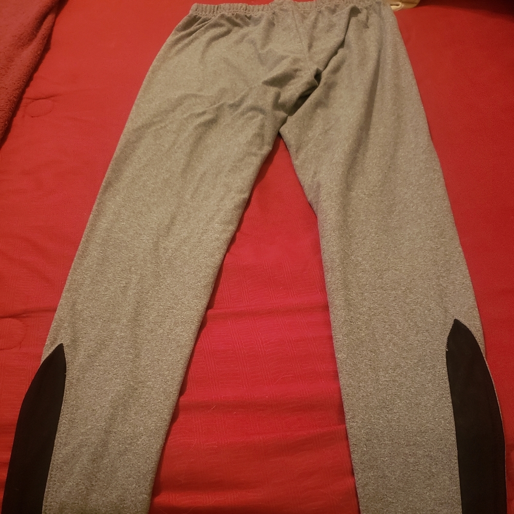 Cute, like new gray leggings with black see through inserts on legs. Size small